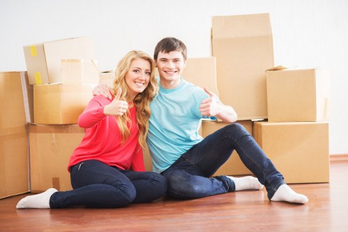 Chelsea packing team carefully wrapping fragile household items
